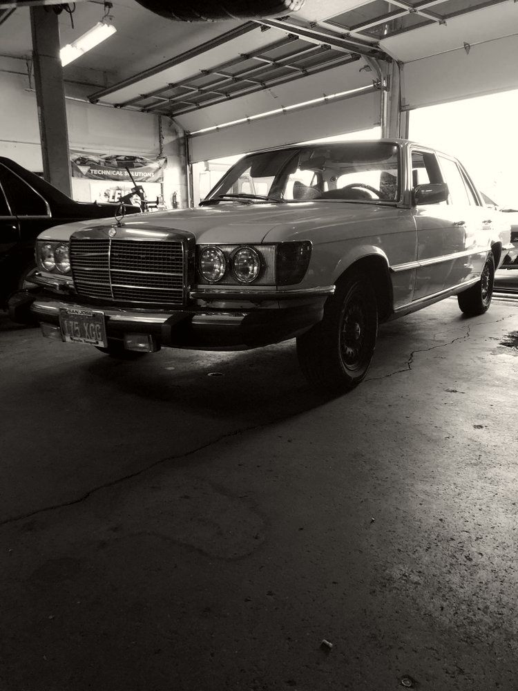 A classic Mercedes sedan parked inside the Campbell All Car workshop